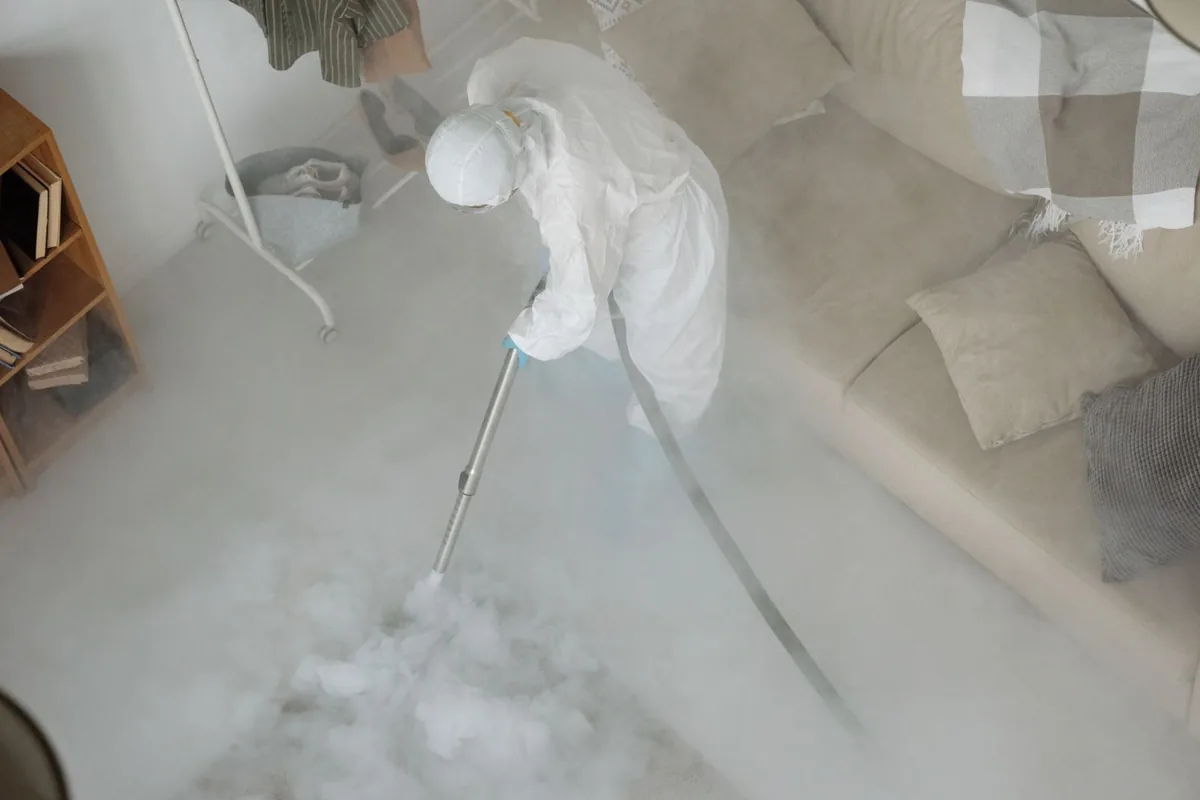Biohazard cleanup technician in protective equipment, Upper Sandusky, OH